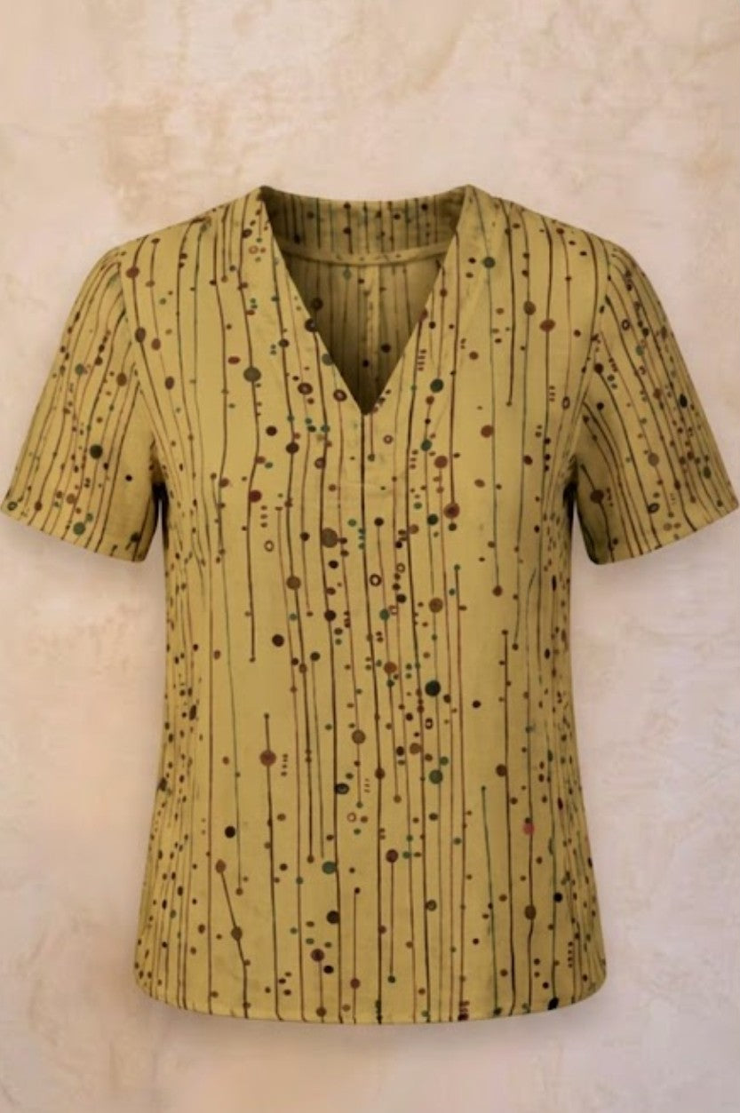 Blusa Claudina realizzata in tessuto a righine colorate su fondo verde